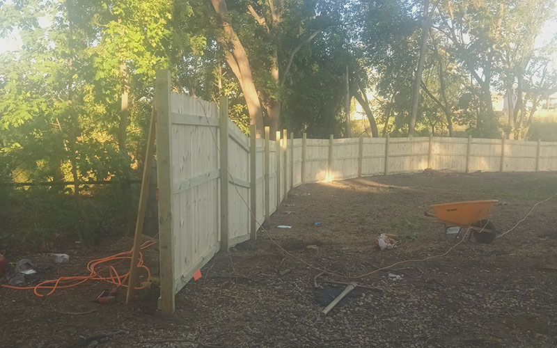 Sealing wooden fence for fence repair in Kansas City